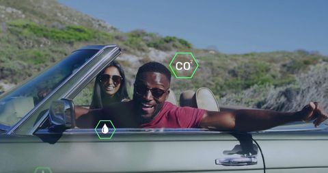 Sustainable tourism: happy couple embracing eco-friendly drive