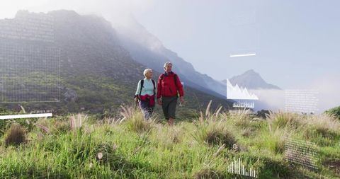 Senior couple hiking in scenic alpine meadow during adventure