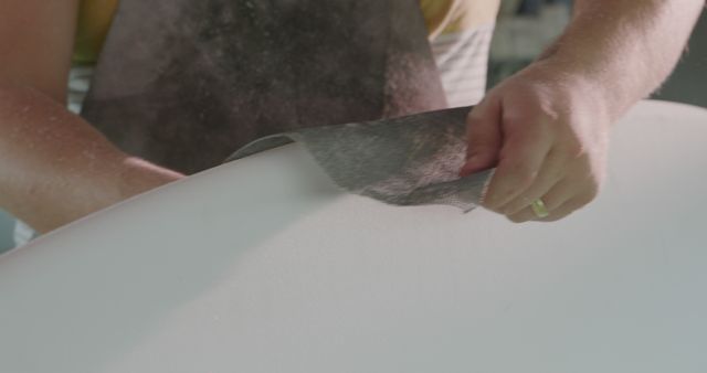 Hand Shaping Surfboard Using Sandpaper in Workshop Close-Up - Download Free Stock Images Pikwizard.com