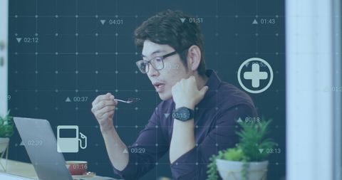 Young Professional Analyzing Data While Eating Dessert