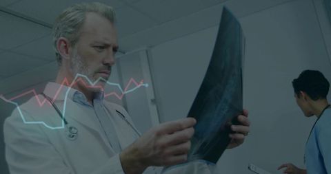Doctor Analyzing X-ray Results with Data Visualizations