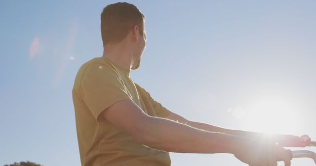 Man Enjoying Sunny Day Outdoors While Riding Bicycle - Download Free Stock Images Pikwizard.com