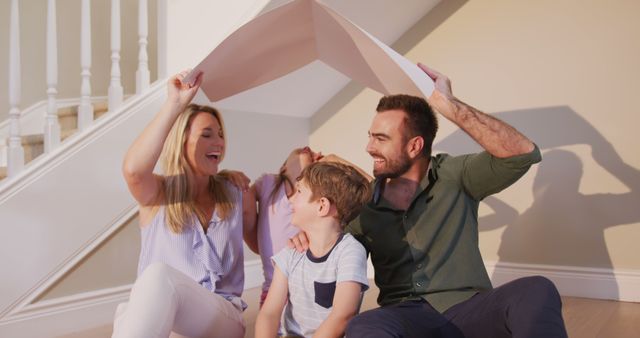 Happy Family Sitting on Staircase with Open Book - Download Free Stock Images Pikwizard.com