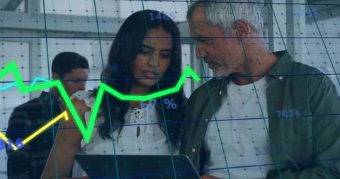 Business Professionals Analyzing Financial Growth Charts on Tablet