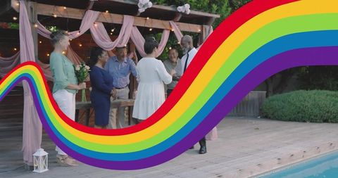 Couple exchanging vows under string-lit arbor by pool with rainbow pride wave overlay