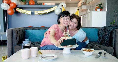 Senior Ladies Enjoying Birthday Celebration and Selfies at Home