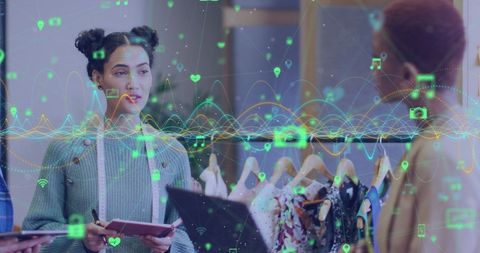 Designers engage in discussion about fashion trends, leveraging data-driven insights through technology. Various digital elements, like graphs and icons, feature collaboratively in conversation, highlighting advancement in fashion innovation. This is suitable for content related to business technology, digital innovation in fashion, and women's roles in tech-driven analysis.