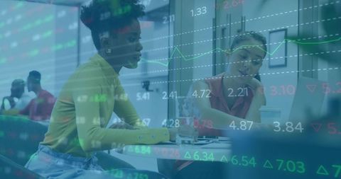 Diverse Businesswomen Analyzing Data with Corporate Technology