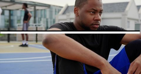Motivated Athlete Sitting on Rooftop Basketball Court
