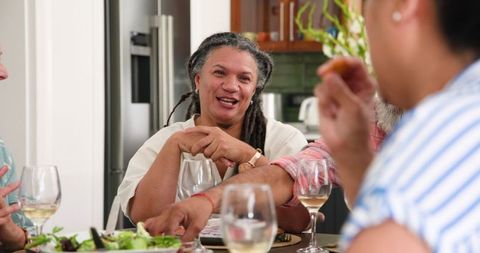 Senior Friends Enjoying Joyful Dinner Gathering