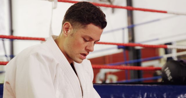 MMA Fighter Preparing in Gym with Focused Expression - Download Free Stock Images Pikwizard.com