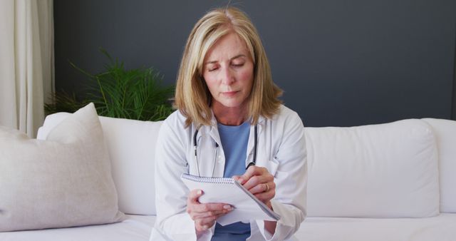 Female Doctor Taking Notes In Office - Download Free Stock Images Pikwizard.com