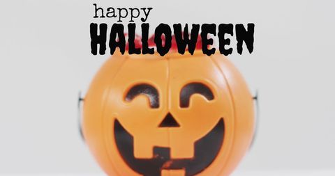 Trick-or-Treat Pumpkin Bucket with Halloween Candies - Download Free Stock Images Pikwizard.com