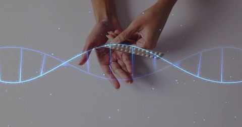 Hands holding pills with digital dna overlay symbolizing biotech innovation