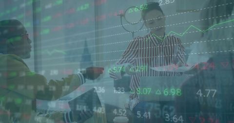 Diverse team analyzing financial market data in modern office