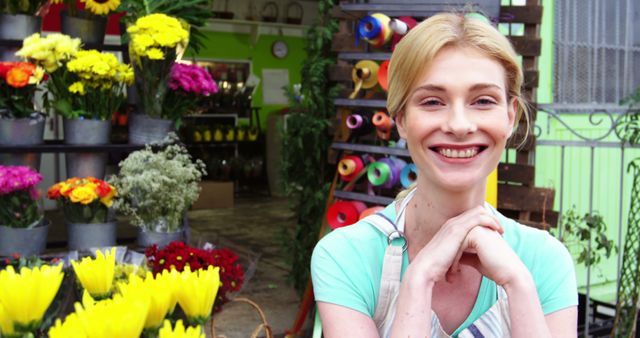 Smiling Blonde Florist with Flowers Display - Download Free Stock Images Pikwizard.com