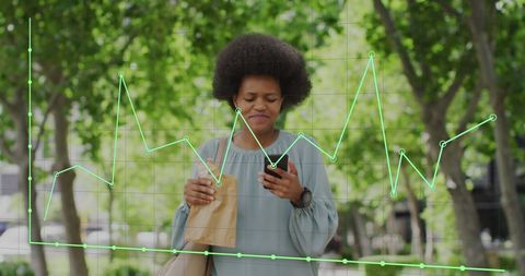 Businesswoman Analyzing Data on Smartphone Outdoors