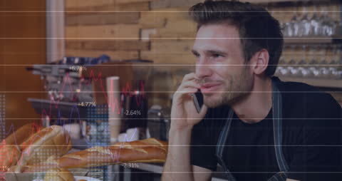 Young Entrepreneur Analyzing Financial Data on Smartphone in Cafe