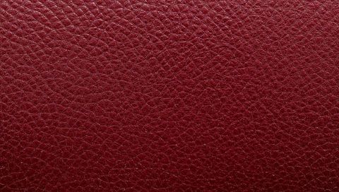 Maroon pebbled leather texture with satin sheen for luxury upholstery and product mockups
