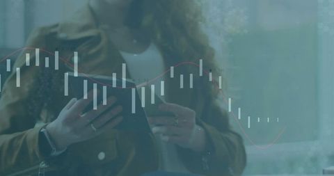 Woman Exploring Financial Data on Tablet with Graph Overlay
