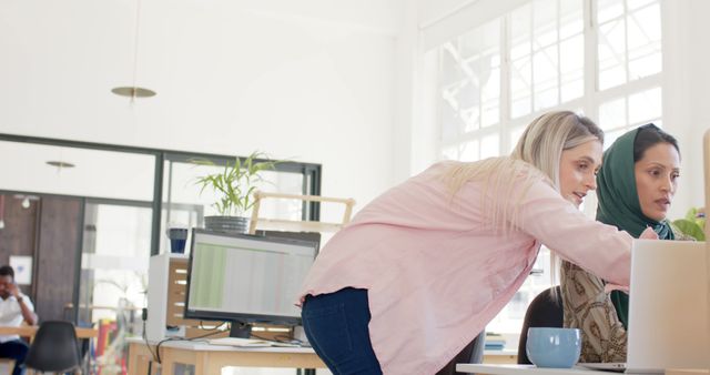 Collaborative Female Coworkers Discussing Work in Modern Office - Download Free Stock Images Pikwizard.com