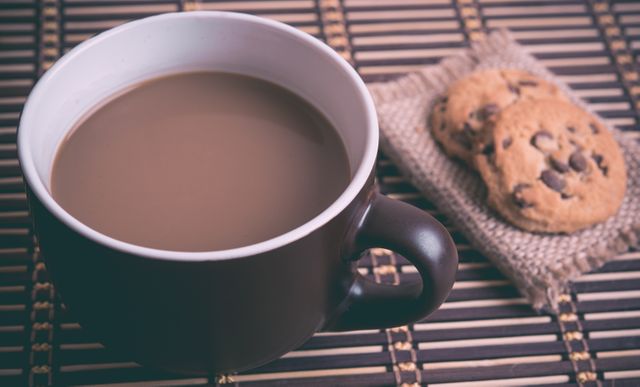 Cup of Hot Coffee with Chocolate Chip Cookies on Bamboo Mat - Download Free Stock Photos Pikwizard.com