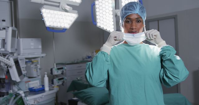 Female Surgeon Wearing Protective Gear in Operating Room - Download Free Stock Images Pikwizard.com