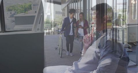 Middle-aged professional talking on smartphone in modern urban office