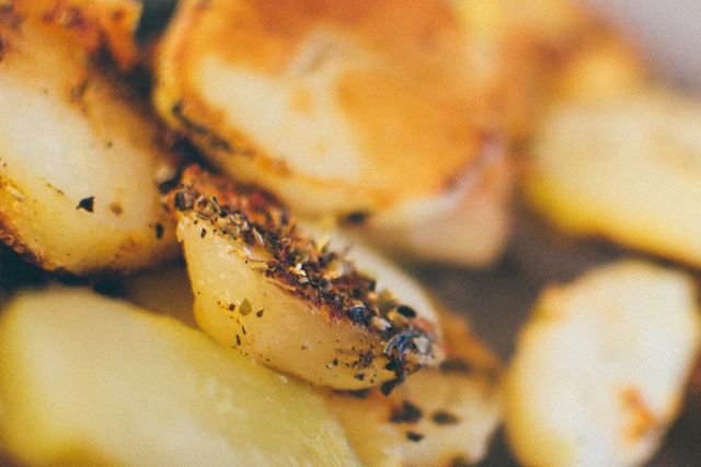 Delicious Roasted Potatoes with Herbs on Rustic Table - Download Free Stock Images Pikwizard.com