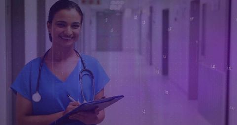Smiling Nurse in Hospital Corridor Writing on Clipboard