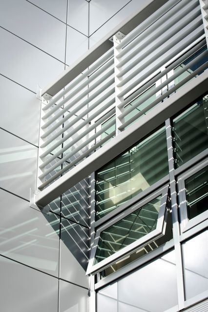 The photo captures the innovative design of NASA Ames Green Building, highlighting modern window shading structures that promote energy efficiency. Ideal for illustrating topics on sustainable architecture, green building techniques, or innovative construction projects. Useful for articles, brochures, and presentations related to environmental sustainability or architectural design.