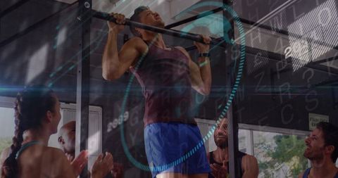 Pull-up athlete using wearable tech and ar overlay while training with group support