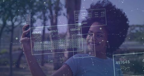 Woman in park interacting with augmented reality data panels