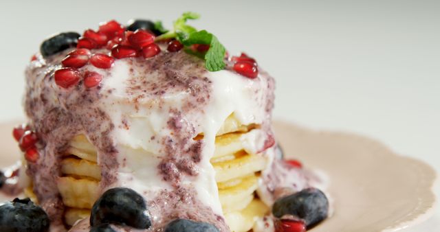 Fluffy Pancakes with Cream, Blueberries, and Pomegranate Seeds - Download Free Stock Images Pikwizard.com