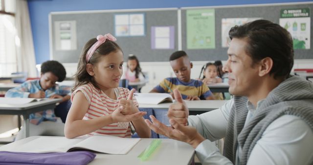 Teacher Engaging with Young Student in a Diverse Classroom Setting - Download Free Stock Images Pikwizard.com