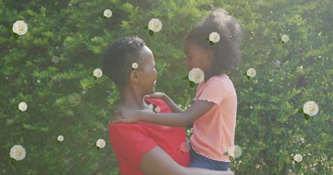 Joyful Mother and Daughter Bonding in Sunny Garden