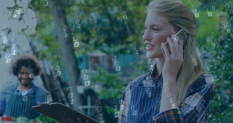 Young Vendor Using Smartphone in Eco-friendly Market with Identical Patterns