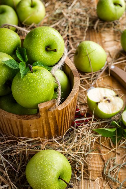 Close-up of Fresh Green Apples in Rustic Wooden Basket - Download Free Stock Photos Pikwizard.com