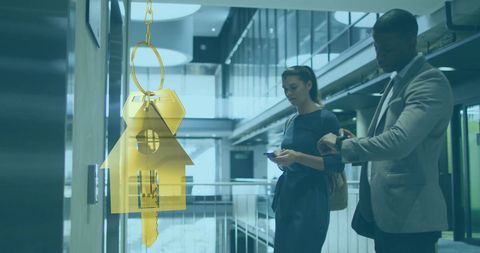 Colleagues in Modern Office with Key Illustration Overlay