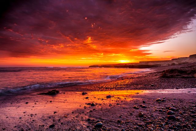 Dramatic Sunset Over Scenic Rocky Beach - Download Free Stock Photos Pikwizard.com