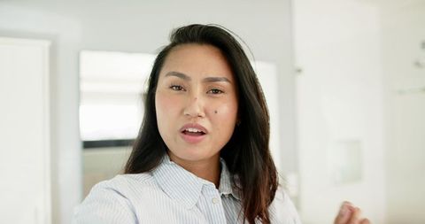 Confident Businesswoman Presenting in Modern Home Office