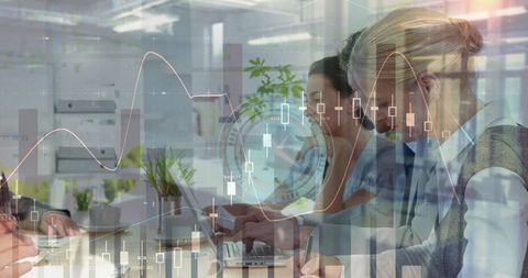 Collaborative Office with Overlaying Financial Graphs and Charts - Download Free Stock Images Pikwizard.com