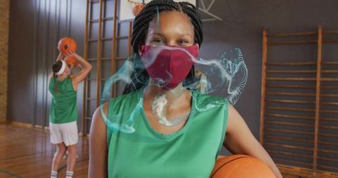 Young Female Basketball Player with Mask in Gym Ready for Game