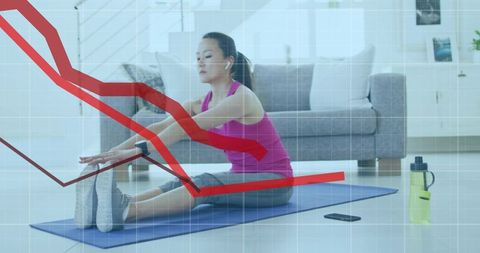 Korean woman stretching on yoga mat at home with phone, bottle and fitness data overlay