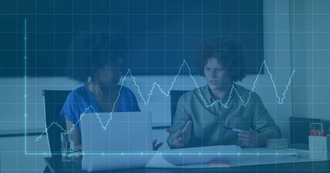 Diverse Colleagues Discussing Financial Data in Office