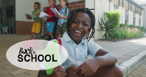 Joyful schoolboy embracing back-to-school spirit