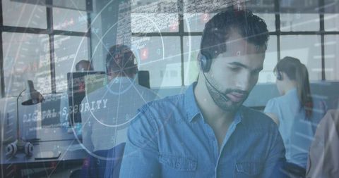 Focused customer support agent engaged in office environment on headset