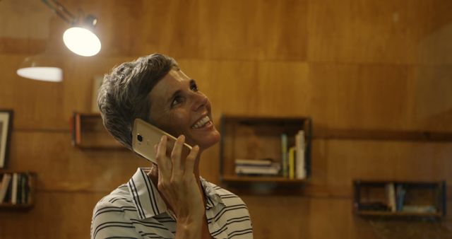 Happy Woman Talking on Phone in Wooden Office - Download Free Stock Images Pikwizard.com