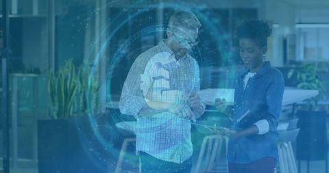 Business Professionals Analyzing Holographic Data in Modern Office Environment