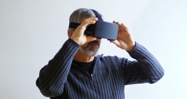 Mature Man Using VR Headset Experiencing Virtual Reality - Download Free Stock Images Pikwizard.com